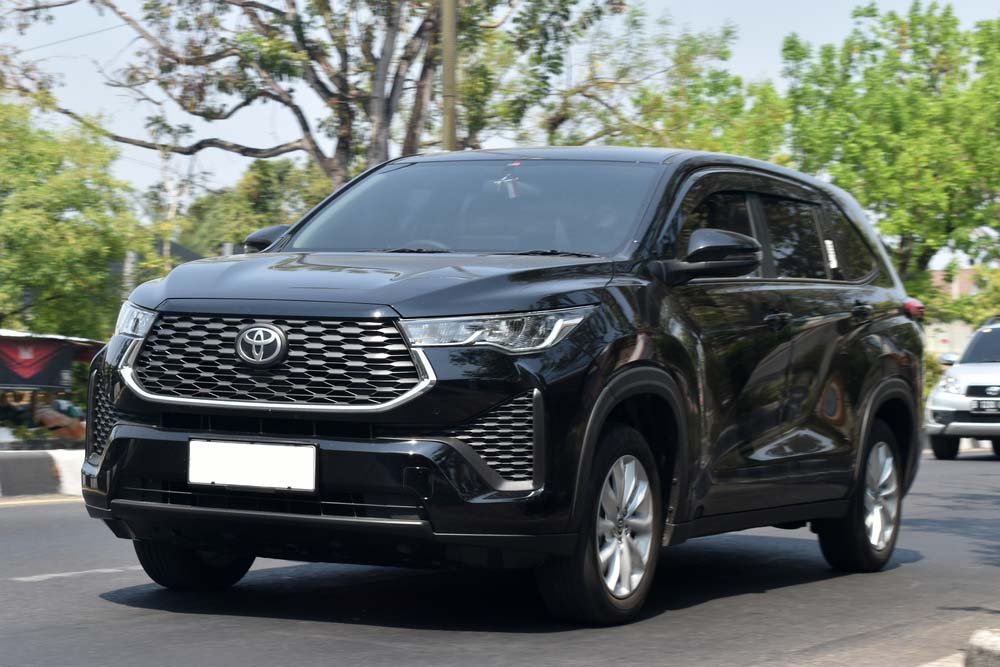 Surakarta, Central Java, Indonesia-October 7, 2023: a black Toyota Kijang Innova Zenix on the move